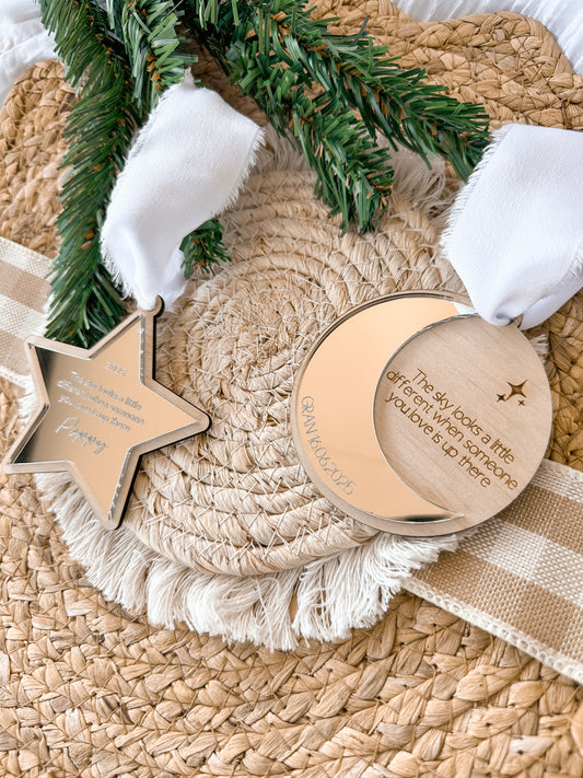 Wooden star and moon-shaped personalised memorial ornaments with engraved text on mirror acrylic with white ribbon, custom christmas ornaments to remember family and lost loved ones, heaven memorial display christmas tree