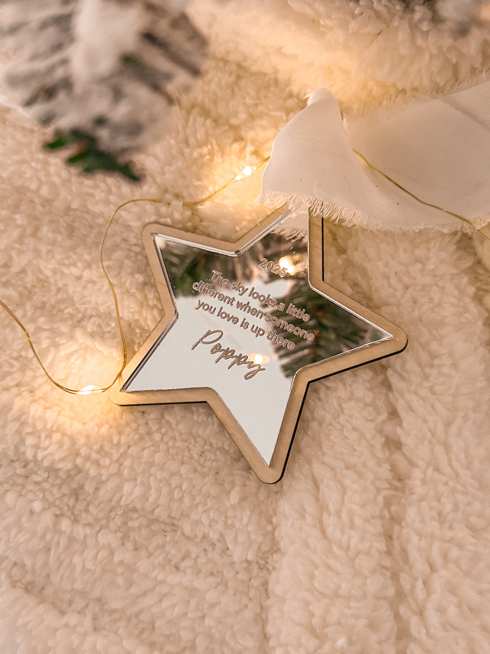 Wooden star and moon-shaped personalised memorial ornaments with engraved text on mirror acrylic with white ribbon, custom christmas ornaments to remember family and lost loved ones, heaven memorial display christmas tree