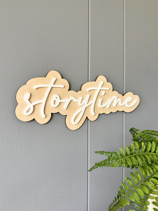 Wooden sign with 'storytime' text for kids playroom reading corner